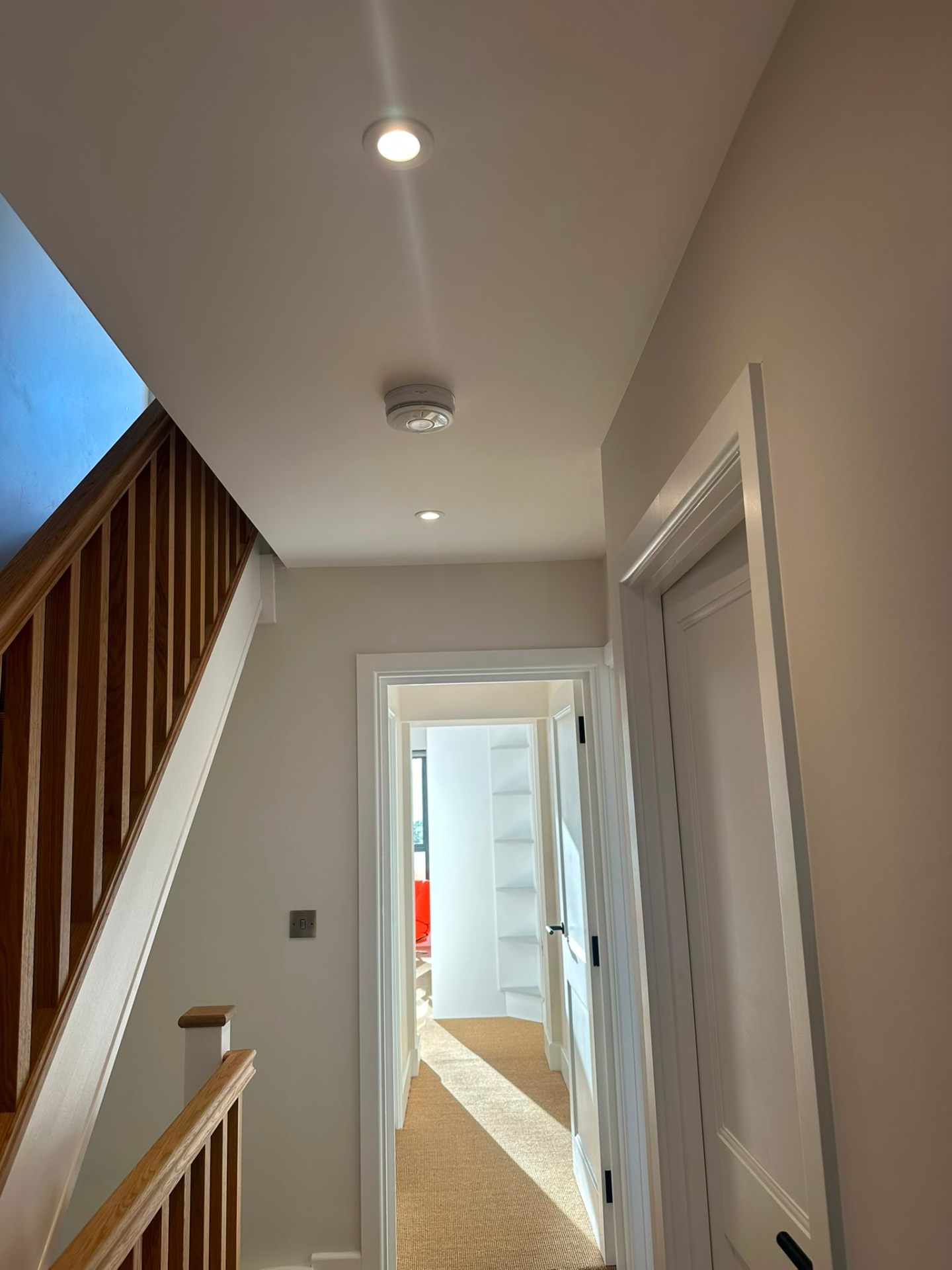 Hallway ceiling with recessed downlights and mains-wired smoke alarm — domestic electrical installation by D.P.L Electrical Services
