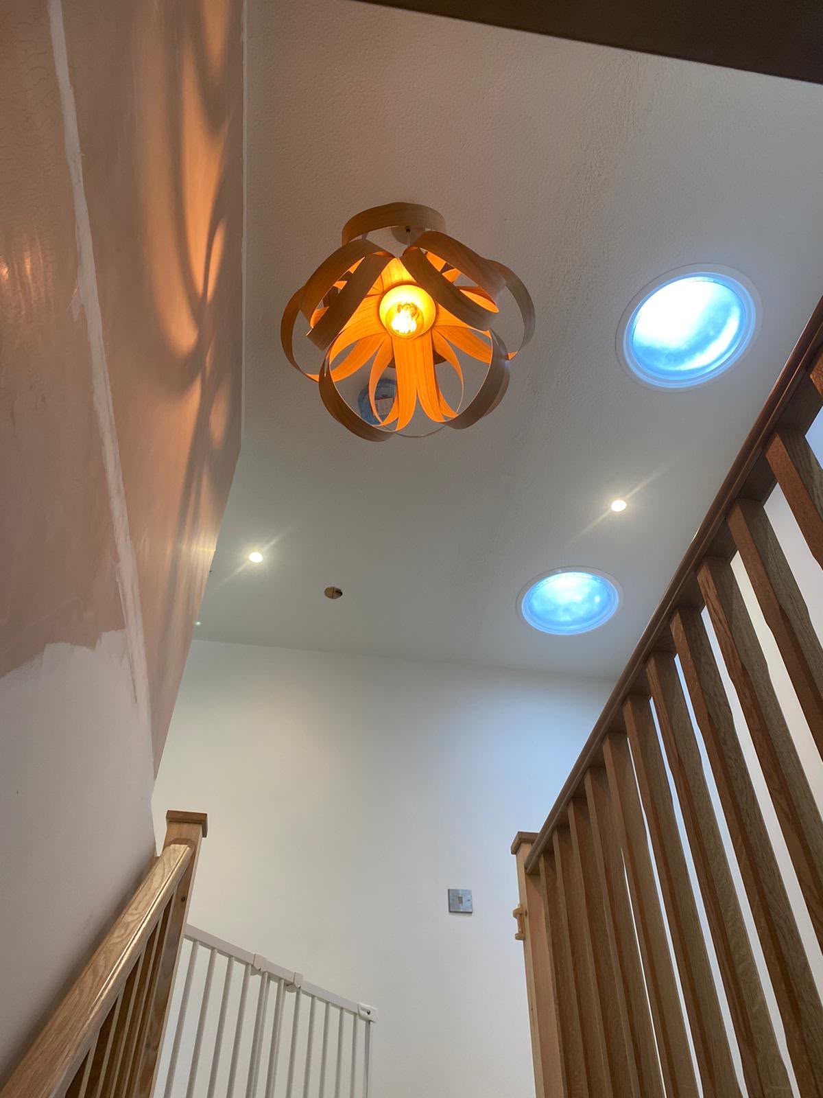 Long hallway with continuous recessed downlights and matched socket outlets — domestic electrical installation by D.P.L Electrical Services