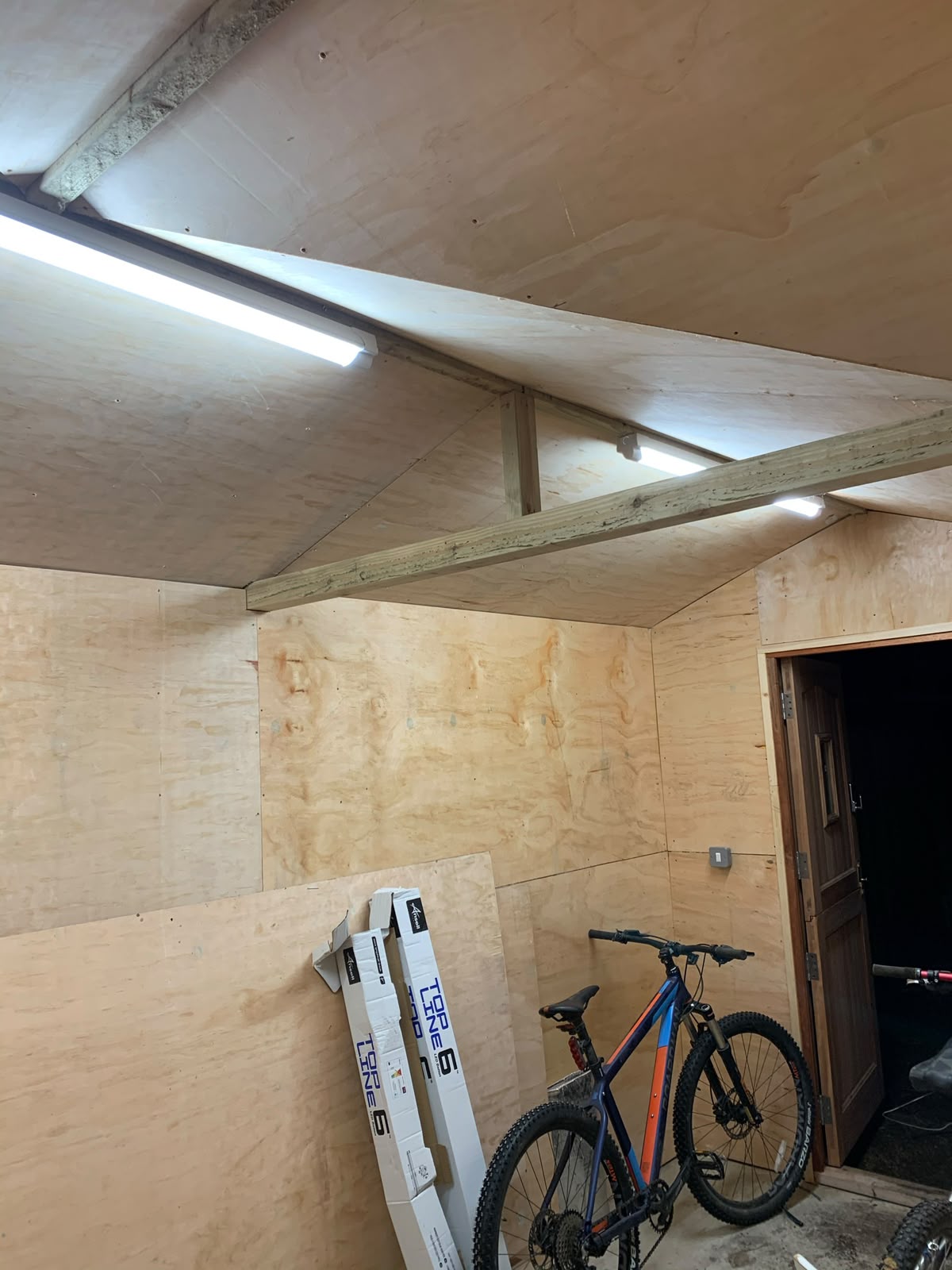 Pantry cupboard with LED strip lighting inside the cabinetry — bespoke kitchen lighting by D.P.L Electrical Services