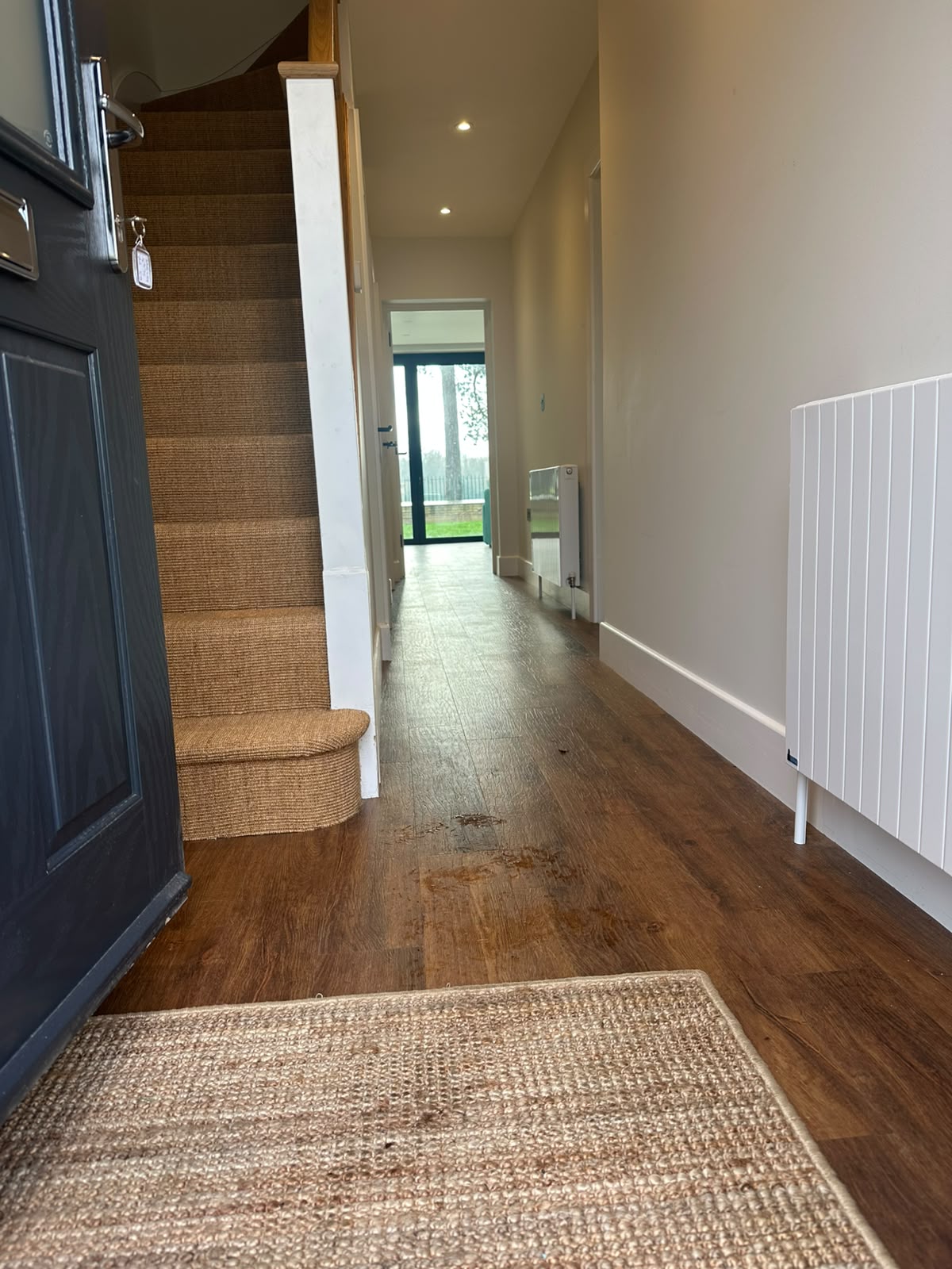 Entrance hallway with LED downlights and a wall-mounted electric heater — domestic electrical installation by D.P.L Electrical Services