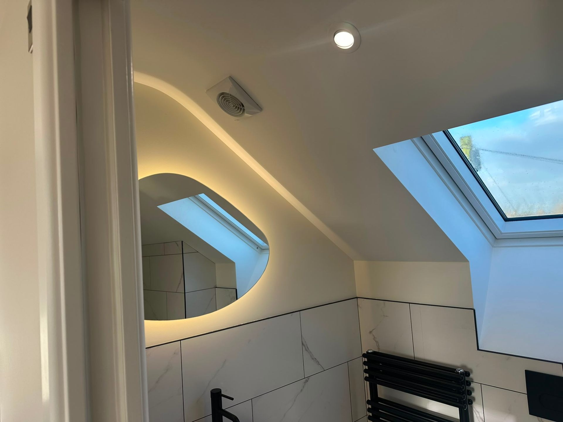 Loft bathroom with recessed LED downlights and skylights — domestic lighting installation by D.P.L Electrical Services in Oxfordshire