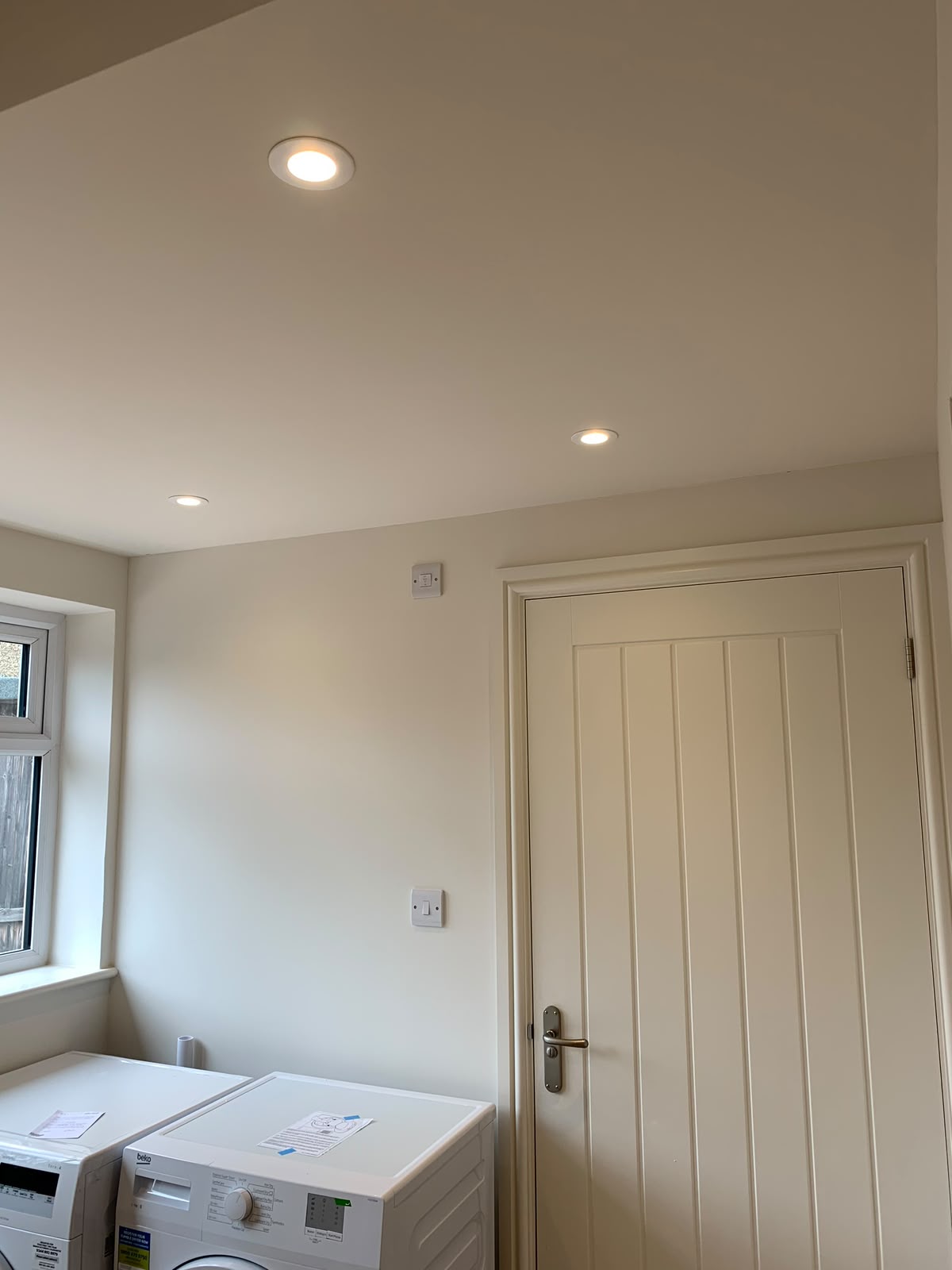 Beamed reception room with dome pendant lights over an oak coffee table — domestic lighting installation by D.P.L Electrical Services