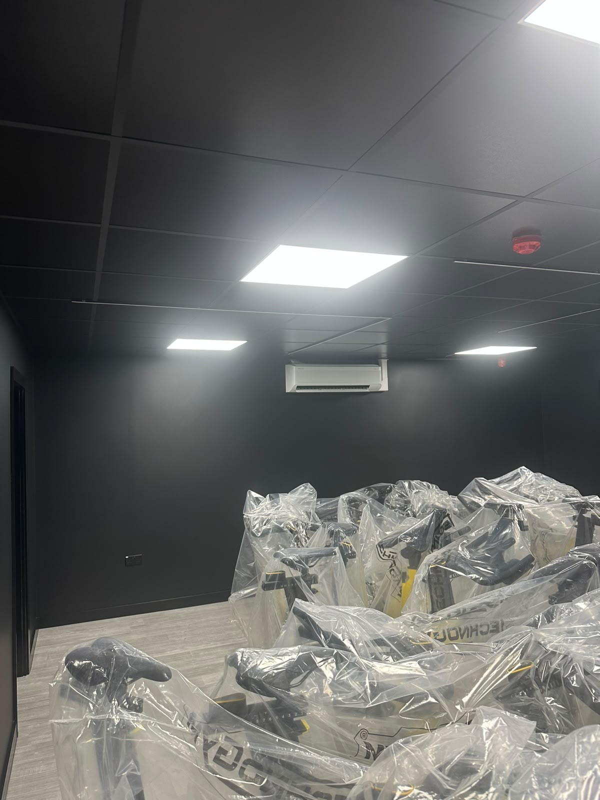 White LED ceiling scene in a commercial spin studio — programmable colour lighting installation by D.P.L Electrical Services