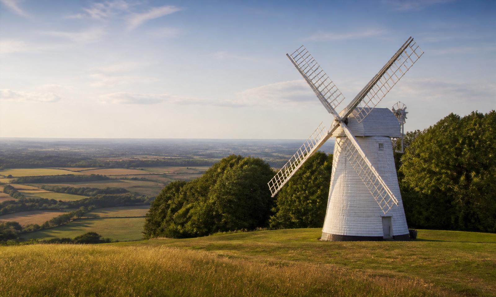 Whiteweatherboard Chiltern Hills windmill above Buckinghamshire farmland — Buckinghamshire electrical services area covered by D.P.L Electrical Services